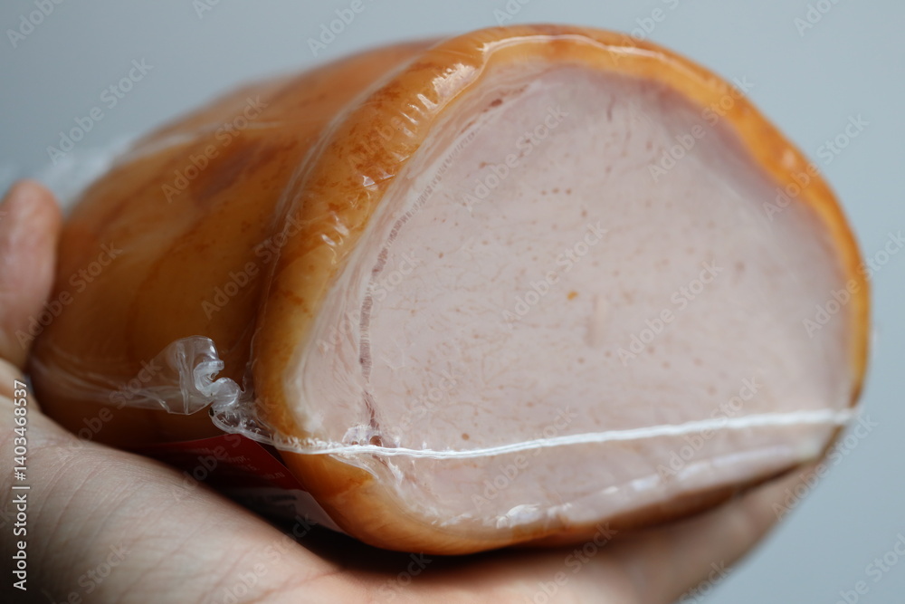 A ham wrapped in plastic, often found in convenience stores or supermarkets.