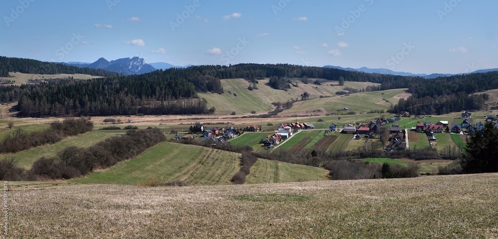 Rural scenery of buildings of village Kacwin among fields, Lesser Poland, Poland