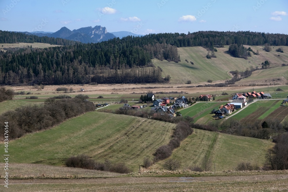 Rural scenery of buildings of village Kacwin among fields, Lesser Poland, Poland