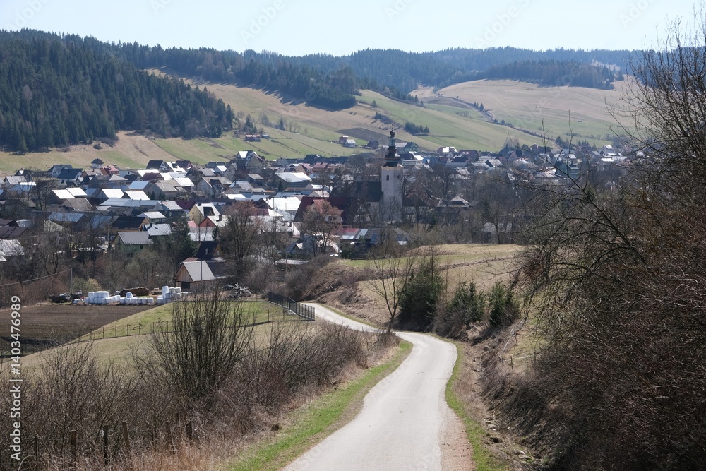 Rural scenery of buildings of village Kacwin among fields, Lesser Poland, Poland
