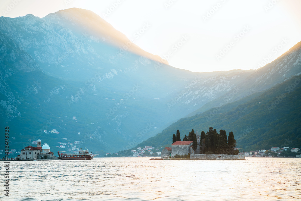Stone monastery on island in calm bay