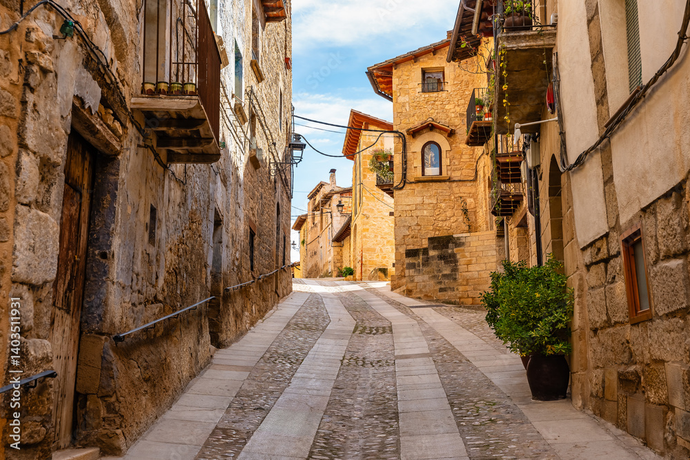 Picturesque stone houses on steep street in the medieval village of Valderrobres, Teruel, Aragon.