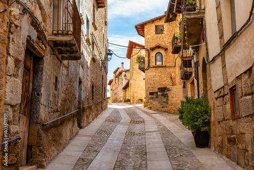 Picturesque stone houses on steep street in the medieval village of Valderrobres, Teruel, Aragon.