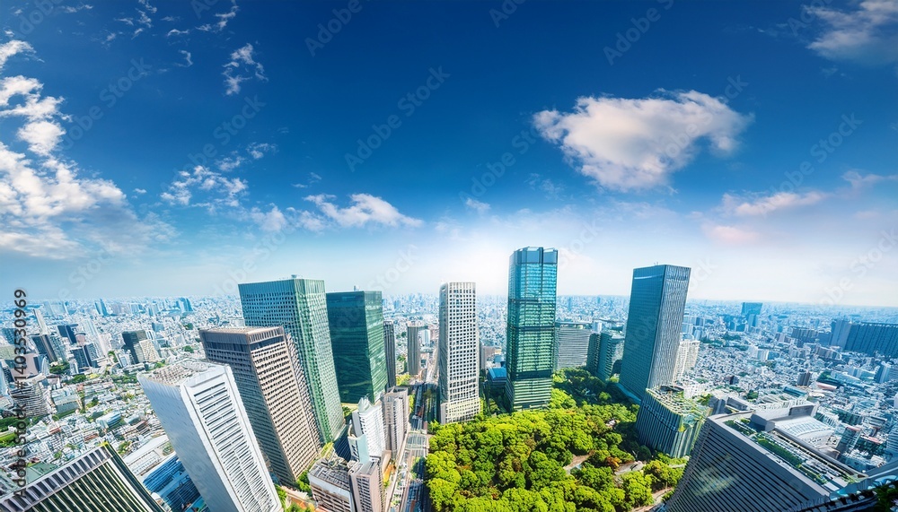 Obraz premium asia business concept for real estate corporate construction and ecology looking up view of panoramic modern city skyline with blue sky and green tree in shinjuku tokyo japan