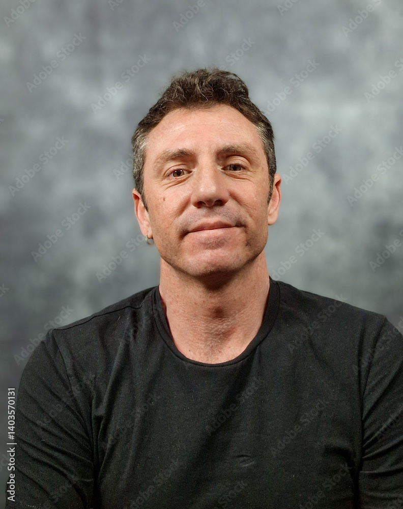 Obraz premium Portrait of an Italian man. The man is forty years old, he is a Norman Sicilian, with light skin, eyes and hair, and is portrayed on a dark background