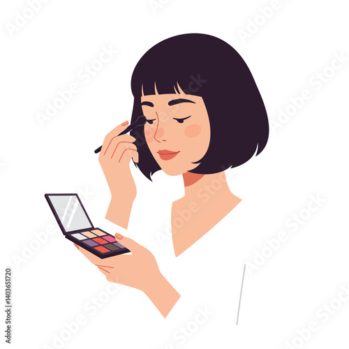 Woman applying makeup using a colorful palette in a bright, minimalist setting