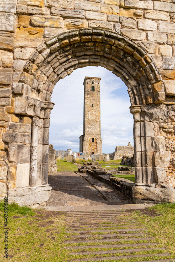 Naklejka premium The ruins of St Andrews Cathedral overlook the sea, surrounded by ancient tombs and old stone walls. A peaceful, sacred place filled with religious history and timeless beauty. Endless architecture.