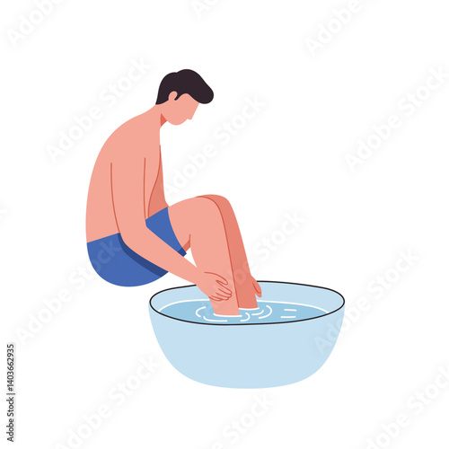 Young man soaking feet in a bowl of water for relaxation and rejuvenation