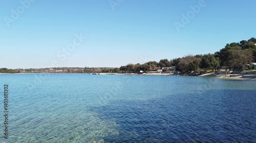 View of the coast of Istria from a small pebble beach in Vrsar, during a winter morning