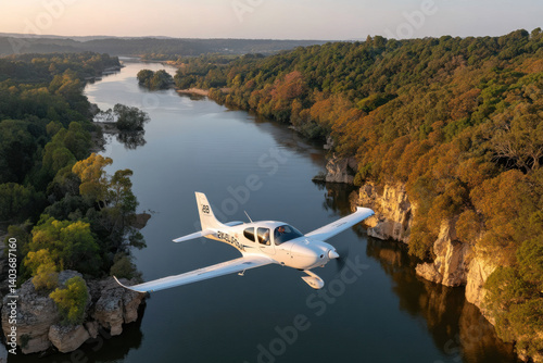 Wallpaper Mural Flying over a serene river with lush trees and rocky cliffs during golden hour, showcasing aerial views of nature’s beauty Torontodigital.ca