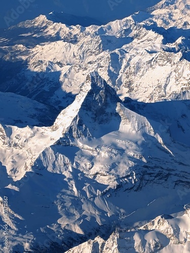 Obraz na płótnie Aerial view of the Swiss Alps in winter with snow covered peaks w salonie