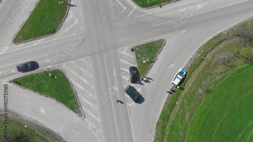 Aerial view Car crash accident at intersection on street, damaged vehicles after collision. Traffic police draw up a traffic accident report