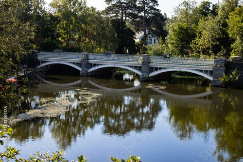 Reflection of the Old Wey Bridge crossing, between Addlestone and Weybridge, over the River Wey Navigations in Surrey