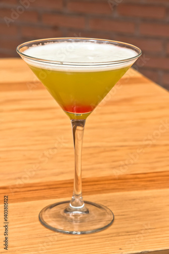 Martini cocktail, Yellow cocktail in a Martini glass, refreshing drink