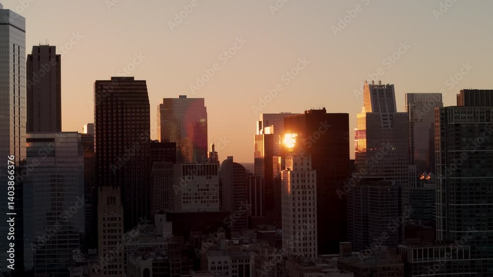 Sunset over skyline of Chicago, casting warm light on the buildings. Sunset over skyline of Chicago, casting warm light on the buildings.