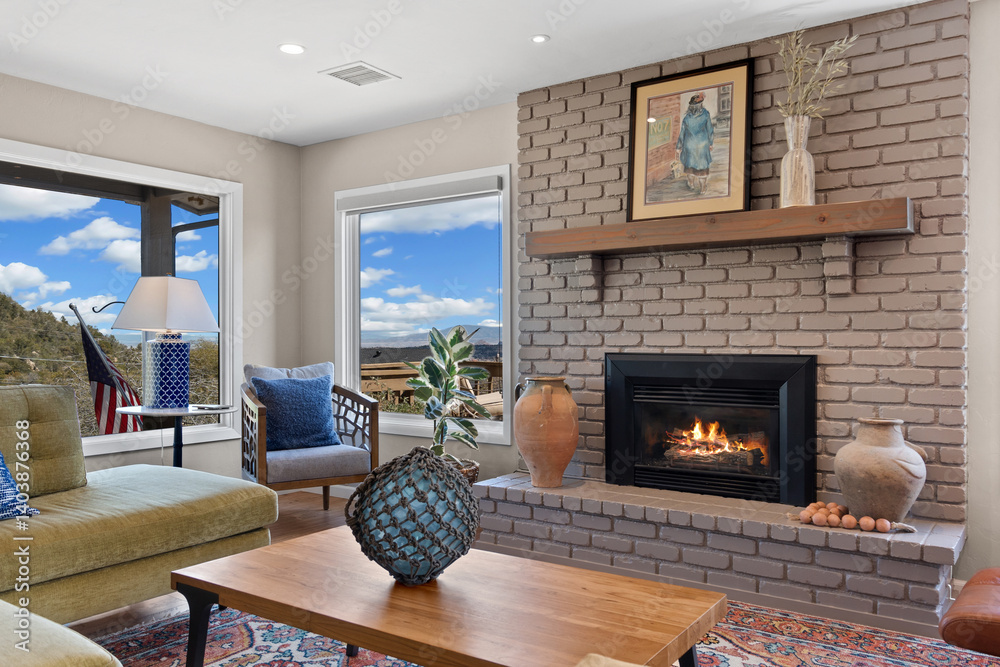 Fototapeta premium A cozy living room featuring a warm fireplace and a spacious, large window