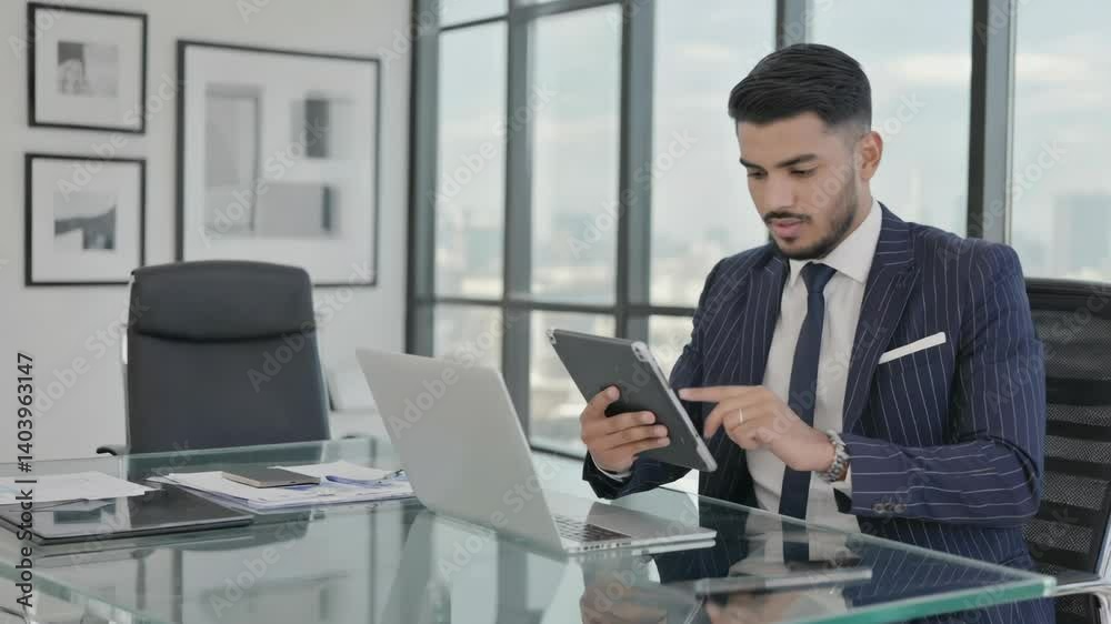 Man in a suit typing away on his cell phone, great for office or corporate use. Man in a suit typing away on his cell phone, great for office or corporate use.