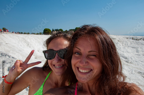 Travel lifestyle. Laughing woman summer selfie, having fun. Summer selfie. Girl friend selfie on summer vacation. Summer vacation. Friendship and fun. Millennial friendship. Friendship lifestyle