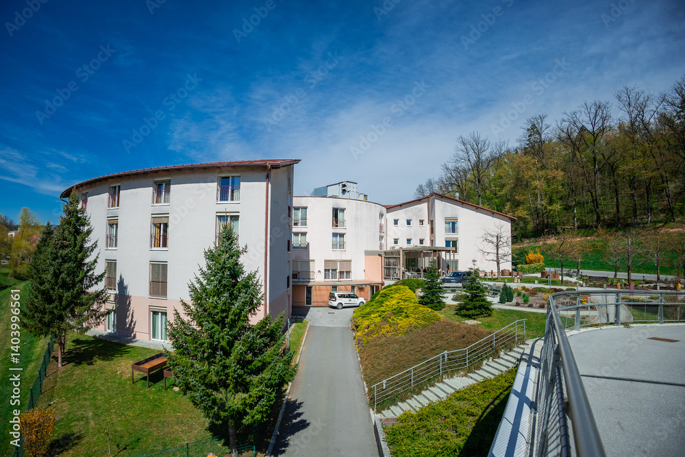 Older or elderly nursing home in the centre of Rogaska Slatina on a sunny spring day. Circular nursing home in slovenia.