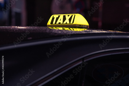 Vienna, Austria: taxi logo on a cab at night