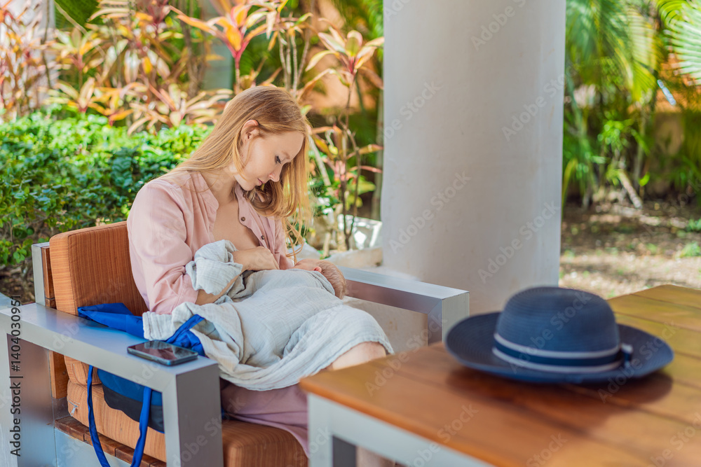 A mother breastfeeds her baby in a cozy cafe, embracing a natural and nurturing moment amidst a casual, public setting. This intimate scene reflects modern parenting, maternal love, and the beauty of