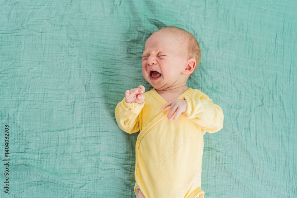 A newborn baby cries while lying on a soft muslin swaddle, expressing emotions and seeking comfort. A tender and natural moment of early infancy, symbolizing vulnerability, needs, and parental care