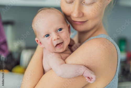 Obraz na płótnie A mother lovingly embraces her newborn baby, holding them close to her chest. A tender moment of warmth, security, and deep maternal love, symbolizing bonding, comfort, and the unbreakable connection w salonie