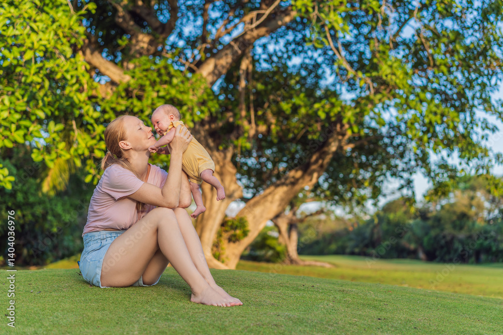Young mother enjoying a peaceful walk in the park with her one-month-old baby. Motherhood, bonding, and outdoor family time concept