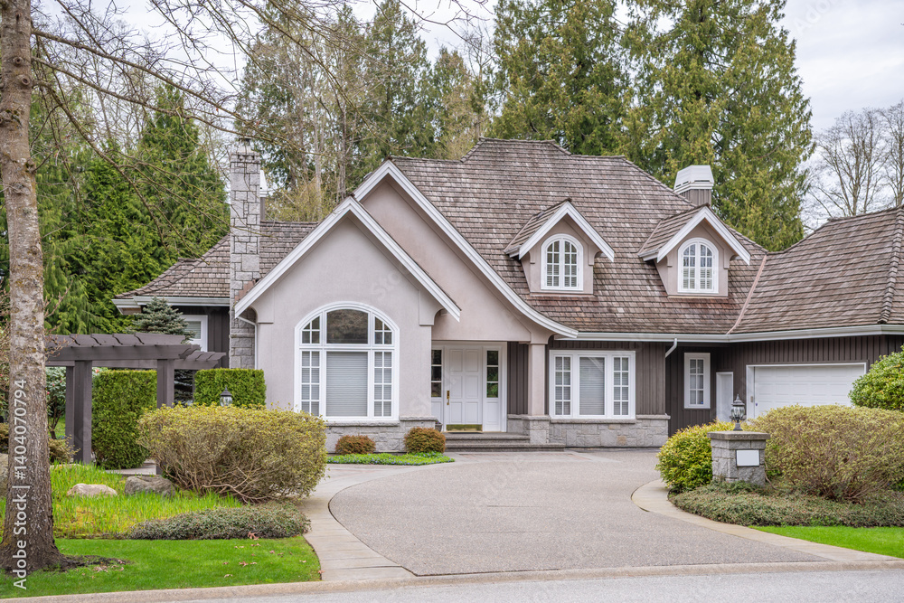 Two story stucco luxury house with nice spring blossom landscape in Vancouver, Canada, North America. Day time on April 2025. Two story stucco luxury house with nice spring blossom landscape in Vancouver, Canada, North America. Day time on April 2025.