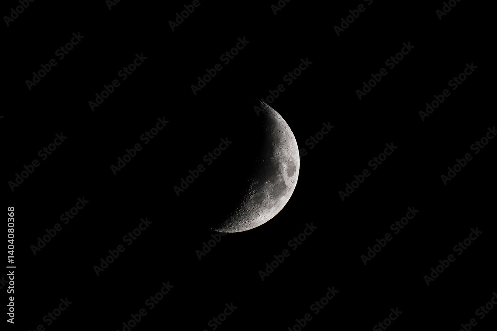 Naklejka premium Crescent over dark black sky