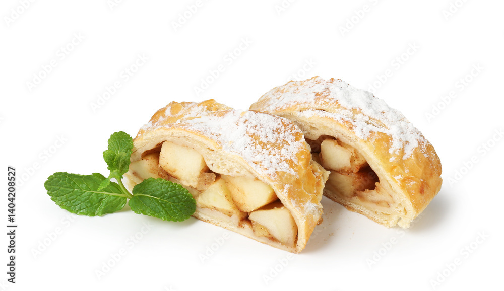 Pieces of tasty apple strudel with powdered sugar and mint isolated on white