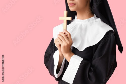 Young nun with cross on pin...