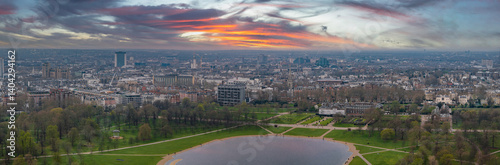 Photography Aerial perspective of Hyde Park with the Serpentine lake, Kensington Palace, and London's cityscape featuring modern and historic architecture
