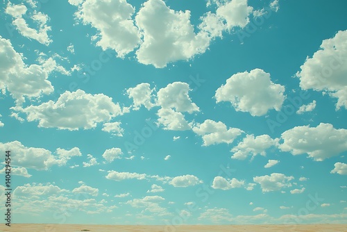 Wide shot of a desert landscape under vibrant blue skies filled with fluffy clouds