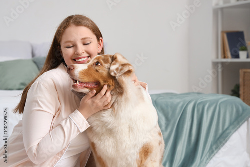 Obraz na płótnie Young woman with cute Australian Shepherd dog at home w salonie