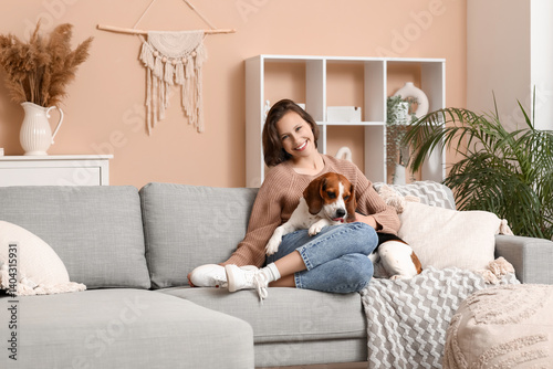 Young woman with cute Beagl...