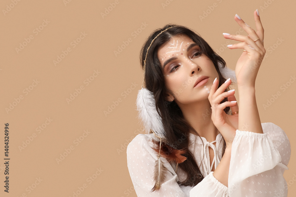 Beautiful female shaman on beige background Beautiful female shaman on beige background