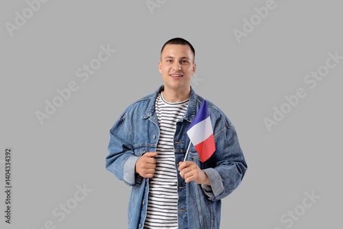Young man with flag of Fran...