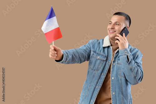 Young man with flag of Fran...