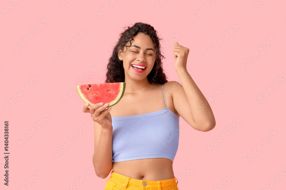 Happy young African-American woman with fresh watermelon on pink background