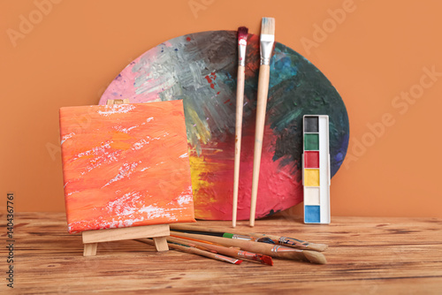 Artist brushes, paints and ...