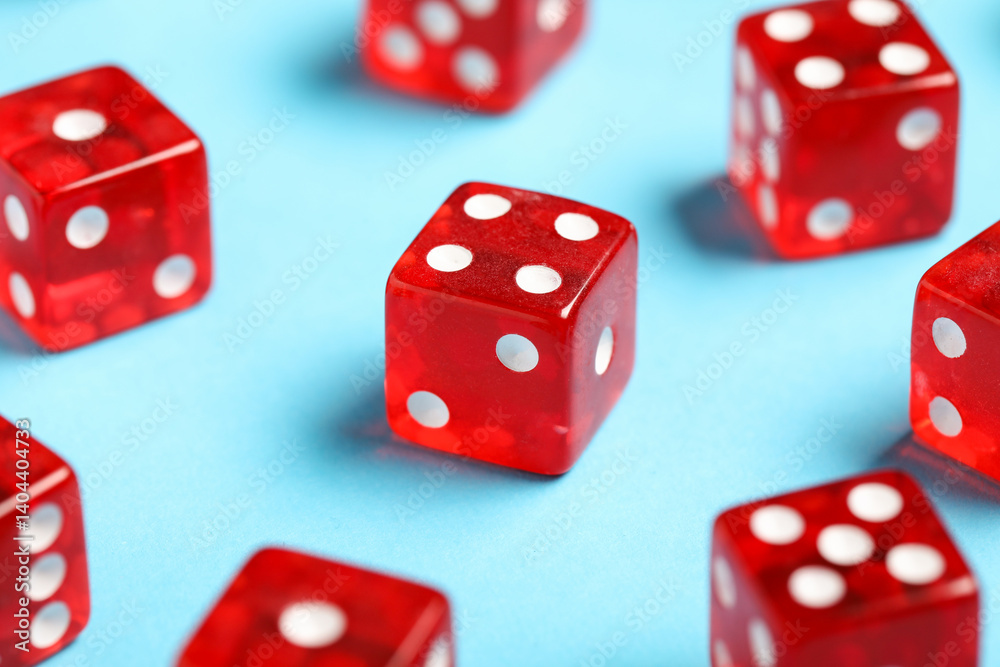 Red game dices on blue background, closeup Red game dices on blue background, closeup