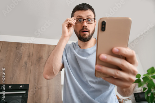 Shocked young man with eyeg...