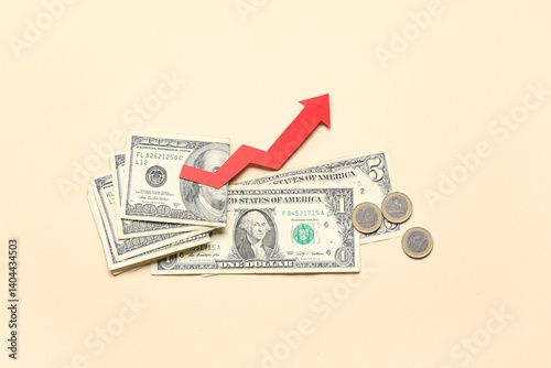 Quadro su tela Money and arrow on beige background. Concept of rising price