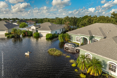 Hurricane Debby tropical rainstorm flooded residential homes and cars in suburban community in Sarasota, Florida. Aftermath of natural disaster