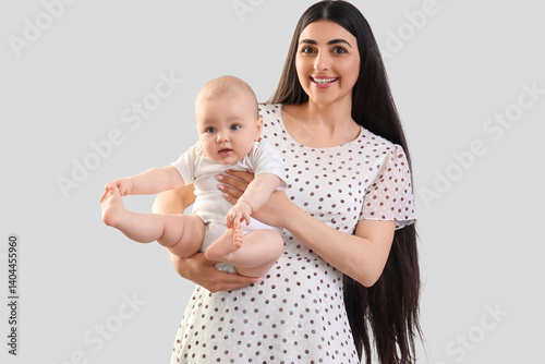 Happy mother holding her li...
