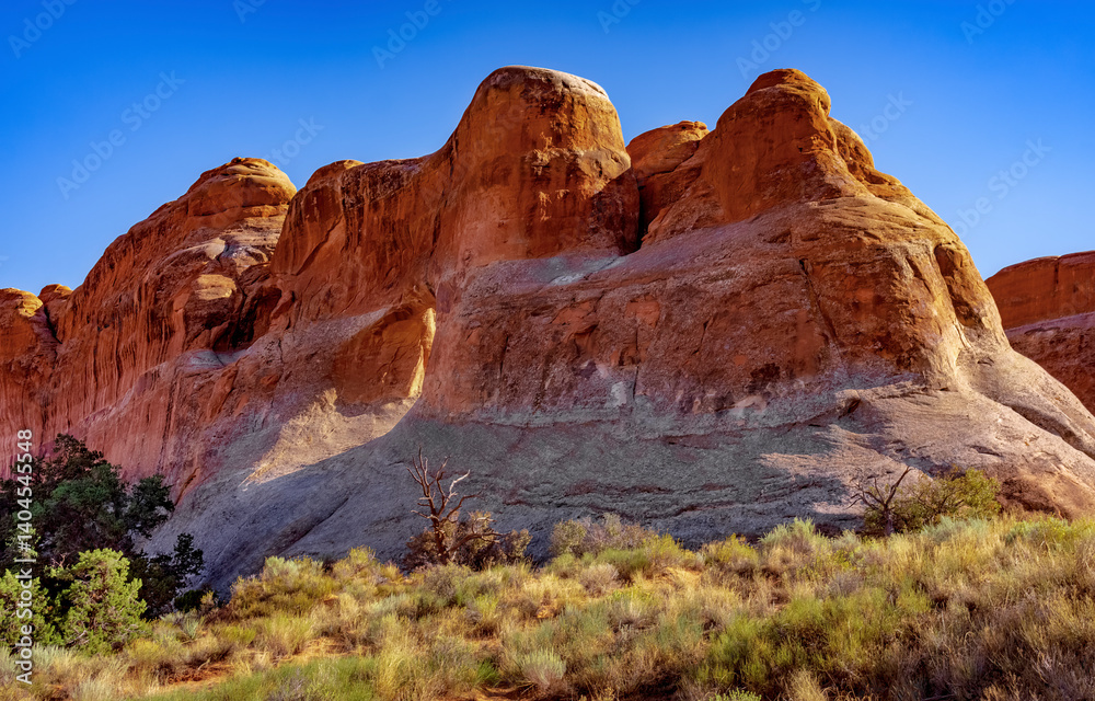 Tall red sandstone walls and spires at Arches National Park near Moab Utah