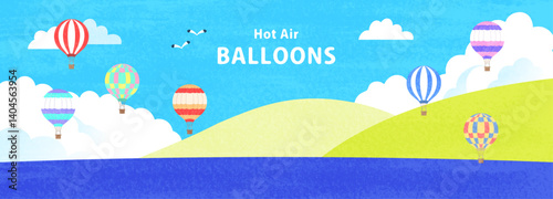 気球が飛ぶ空と海の風景イラスト
