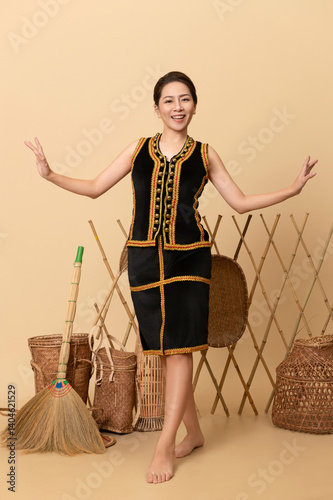Beautiful Female Kadazandusun Native in traditional costume posing in plain background