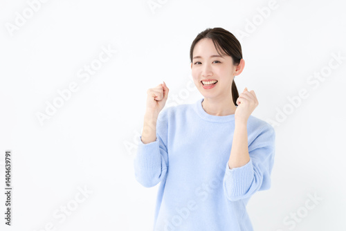 ガッツポーズする女性 photo